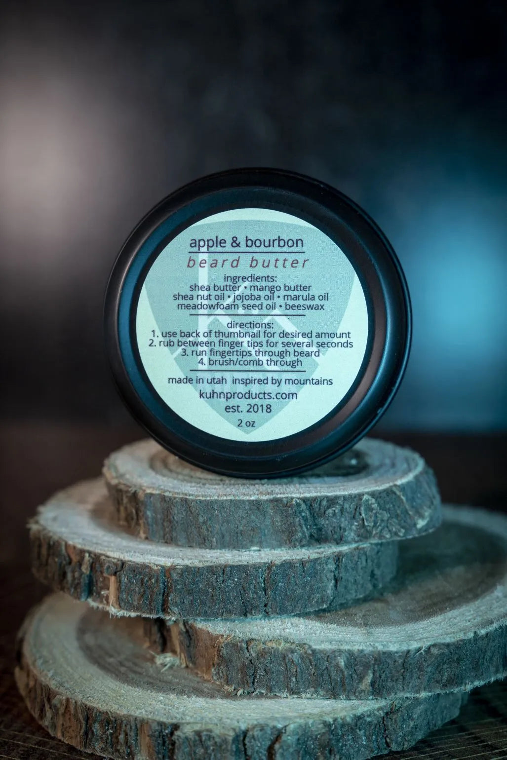 A 2oz tin of apple & bourbon beard butter by kühn products.