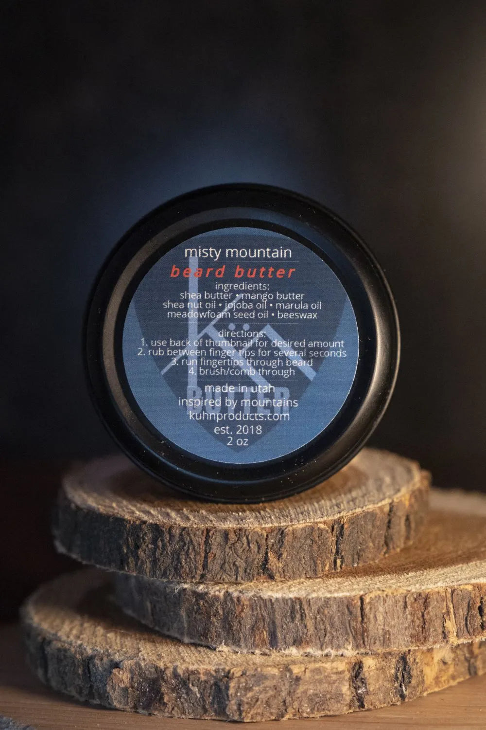 A 2oz tin of misty mountain beard butter by kühn products.