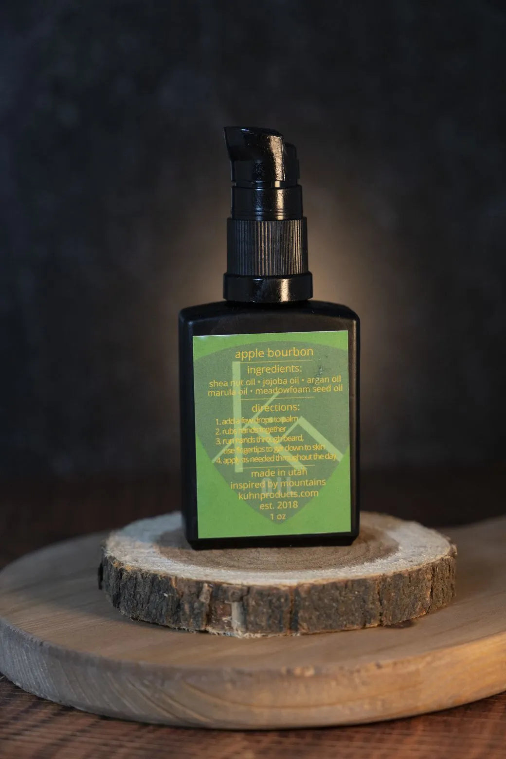 A 1 oz bottle of apple & bourbon beard oil by kühn products.