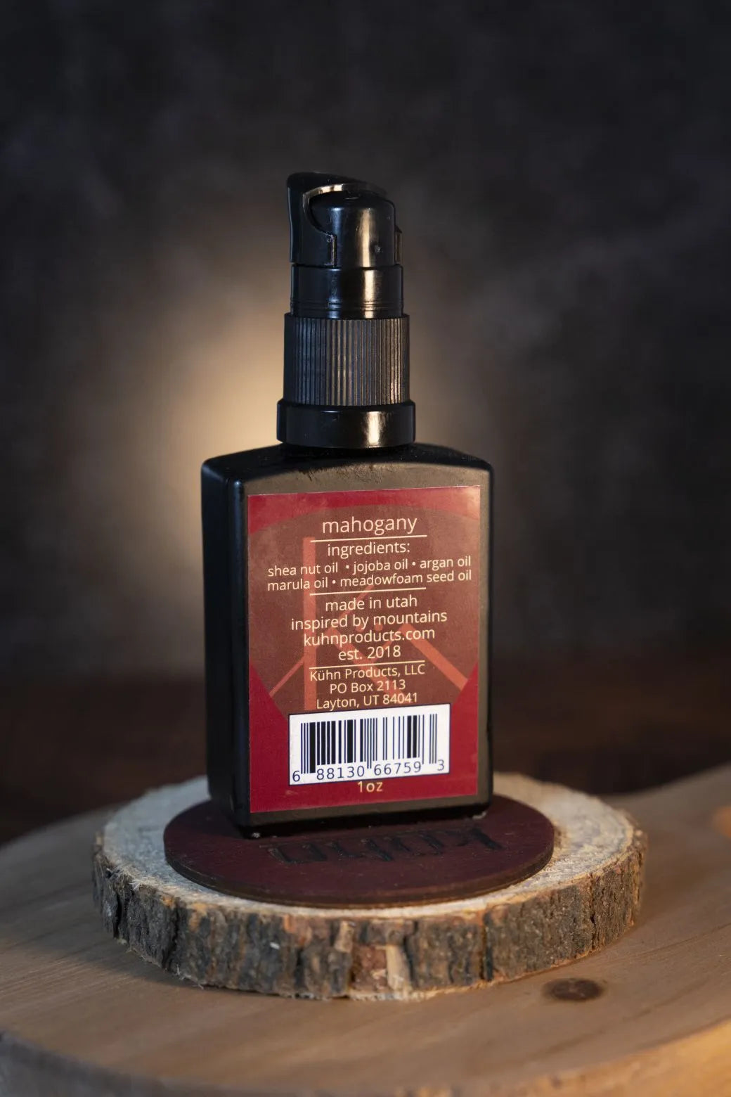 A 1 oz bottle of mahogany beard oil by kühn products.