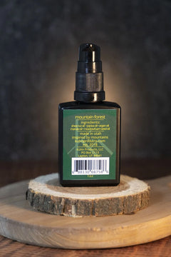 A 1 oz bottle of mountain forest beard oil by kühn products.