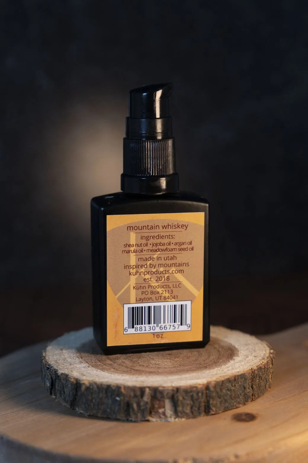 A 1 oz bottle of mountain whiskey beard oil by kühn products.