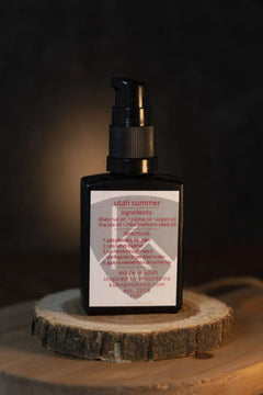 A 1 oz bottle of utah summer beard oil by kühn products.