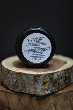 A 2oz tin of cedar & cinnamon beard butter by kühn products.