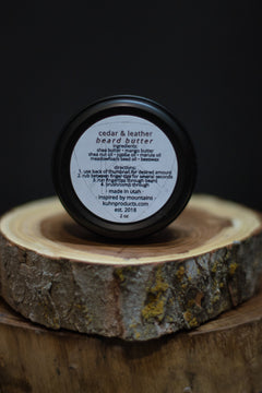 A 2oz tin of cedar & leather beard butter by kühn products.