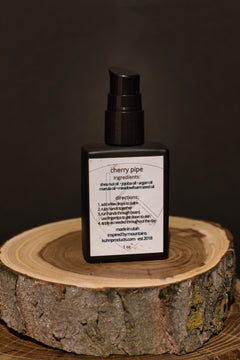 A 1 oz bottle of cherry pipe beard oil by kühn products.