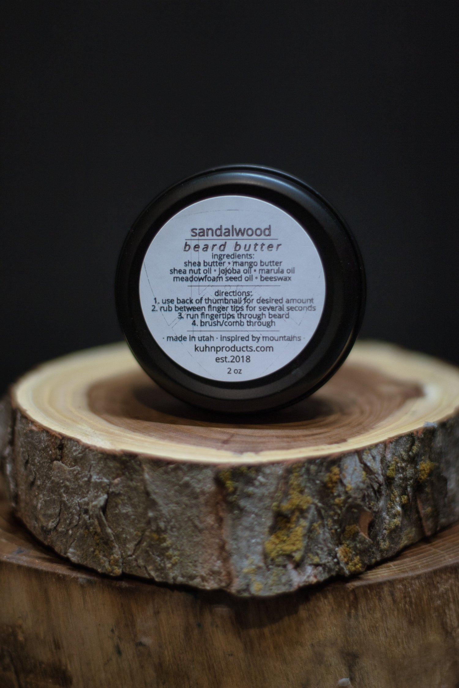 A 2oz tin of sandalwood beard butter by kühn products.