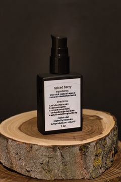 A 1 oz bottle of spiced berry beard oil by kühn products.