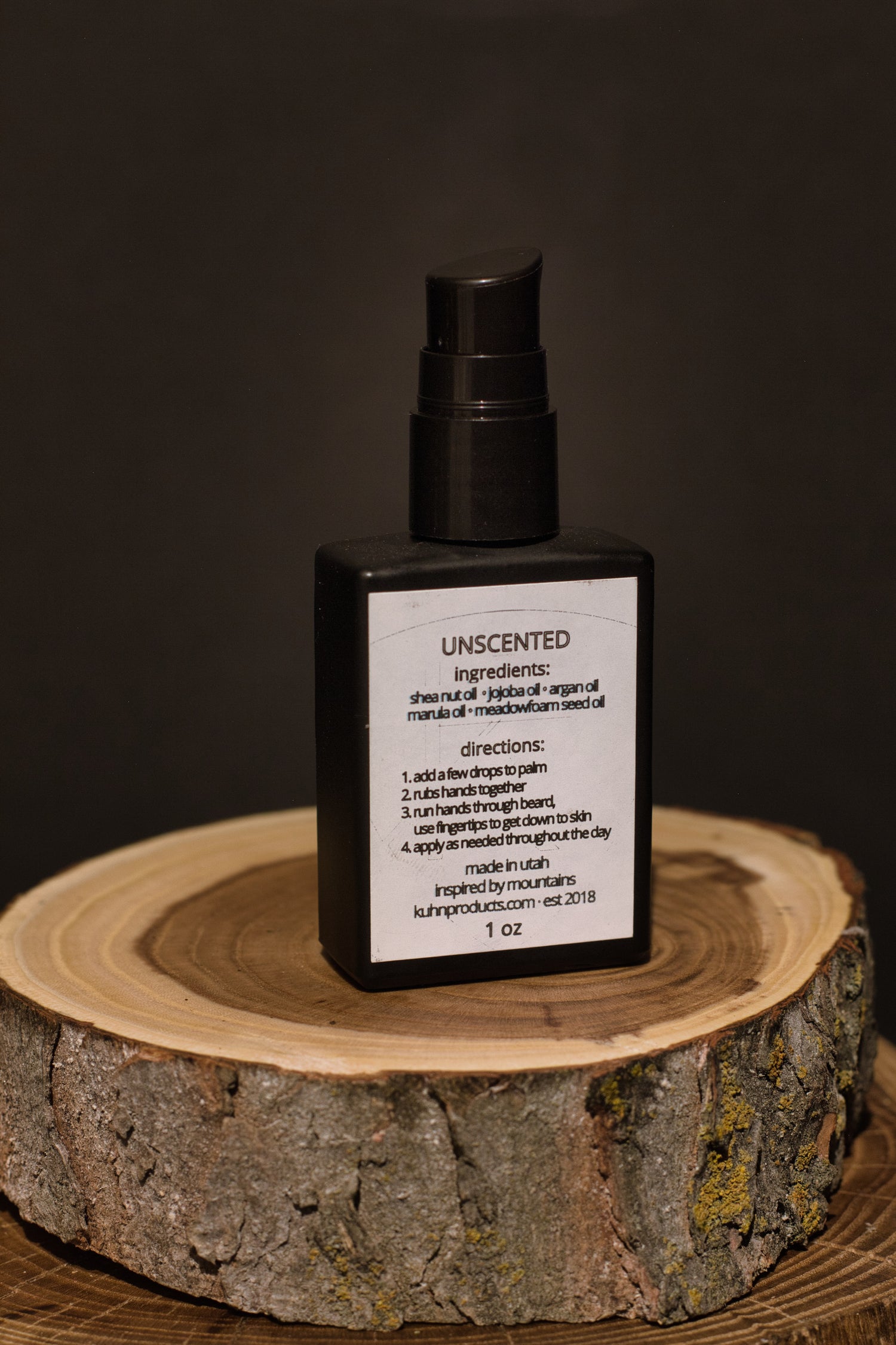 A 1 oz bottle of unscented beard oil by kühn products.