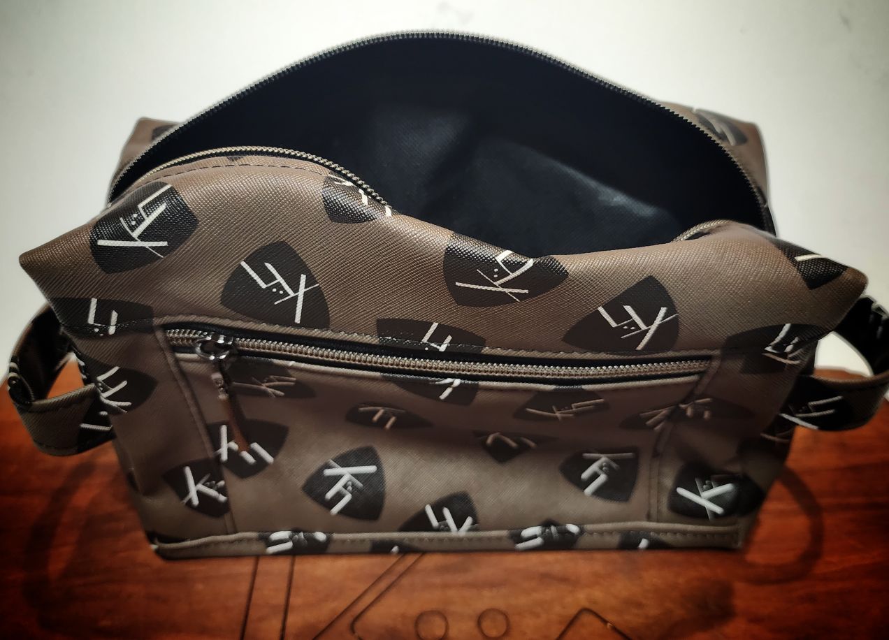 Toiletry bag dopp kit from kühn products olive with black kühn logo top view.