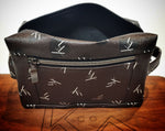 Load image into Gallery viewer, Toiletry bag dopp kit from kühn products dark brown with white logo top view.
