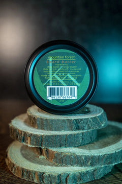 A 2oz tin of mountain forest beard butter by kühn products.