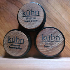 3 2 oz tins of beard butter by kühn products showing the wood labels.